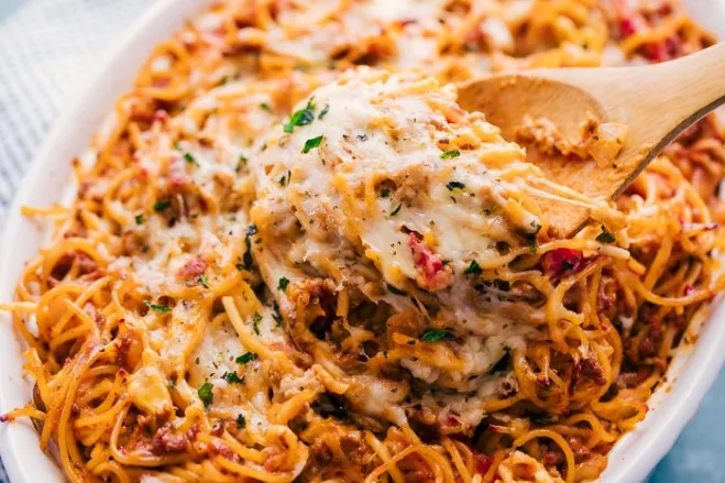 1. Spaghetti casserole served in a white dish, showcasing a delicious blend of pasta and sauce, ready to be enjoyed food recipes with ground beef