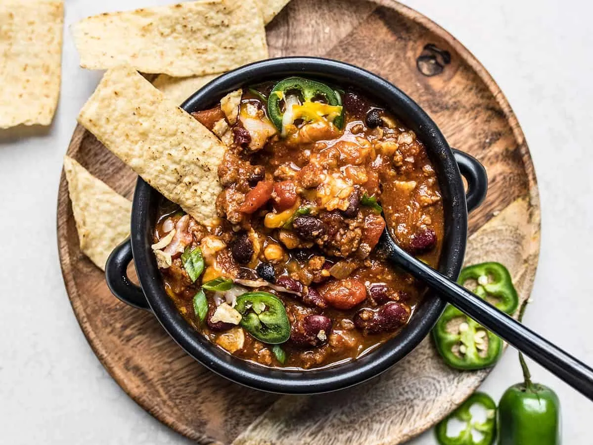 A vibrant display of numerous Mexican chili peppers arranged artistically, showcasing their rich colors and textures dinner with hamburger meat ideas