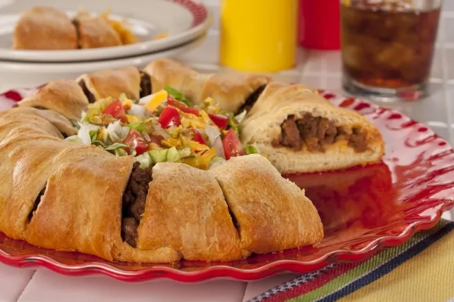 1. A taco crescent roll topped with a fresh salad, showcasing a colorful and appetizing dishground hamburger meat recipes