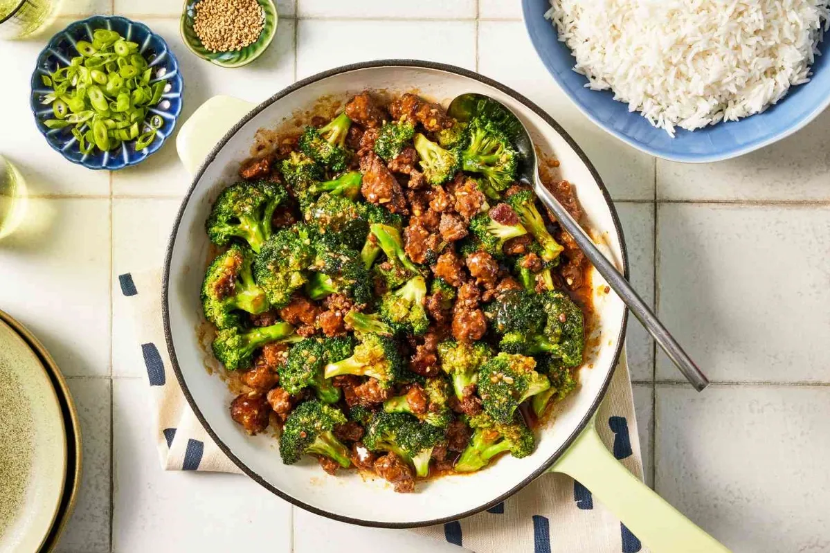 A skillet filled with sautéed broccoli and meat, showcasing a colorful and appetizing dish ready to be served dinner ideas using ground beef