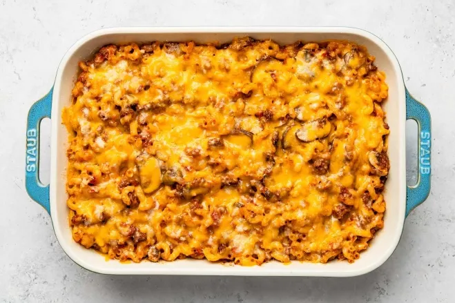 1. A casserole dish filled with melted cheese and savory meat, showcasing a delicious and hearty mealdishes made with hamburger