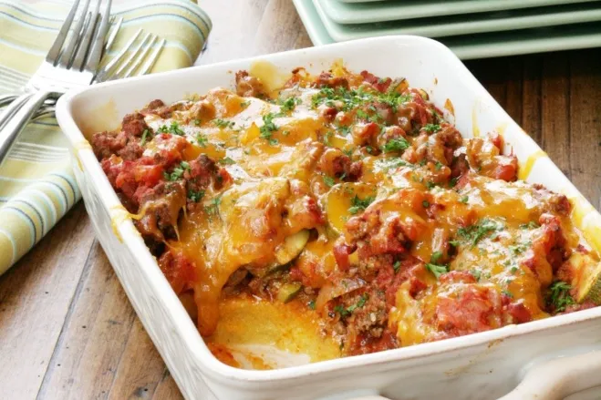 A casserole dish filled with savory meat and topped with melted cheese, ready to be served recipes made with hamburger meat