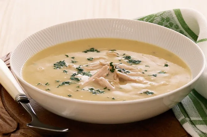 1. A warm bowl of chicken and dumpling soup, featuring tender chicken pieces and fluffy dumplings in a savory broth cream of chicken soup