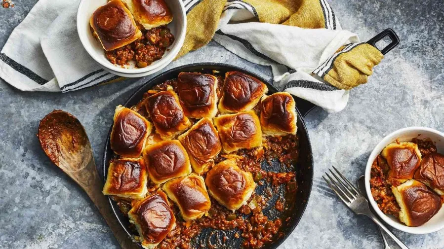 1. A pan filled with golden-brown meat and cheese rolls, showcasing a delicious and appetizing dish ready to be servedmeals made with hamburger meat