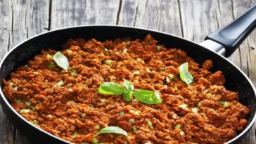 1. A pan containing a mixture of ground beef and assorted vegetables, ready for cooking or serving cream of chicken soup