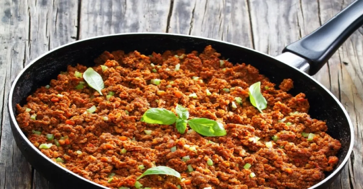 1. A pan containing a mixture of ground beef and assorted vegetables, ready for cooking or serving cream of chicken soup