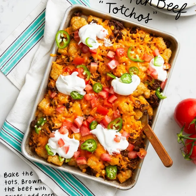 1. A delicious taco casserole topped with sour cream and various toppings, served in a vibrant dish ground beef